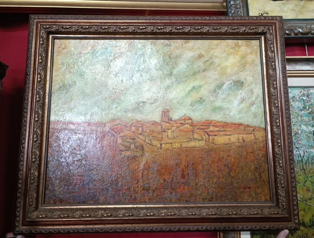 Cuadro al óleo con marco ornamentado dorado e imagen de un pueblo 1